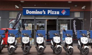 Domino’s shares climb despite slipping profits