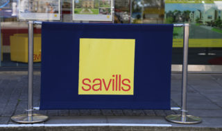 Savills rises on year-end update