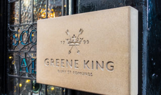 Greene King shares up despite falling profits